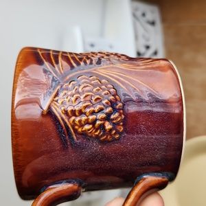 Pair of Big Sky Carvers vintage pine cone mugs